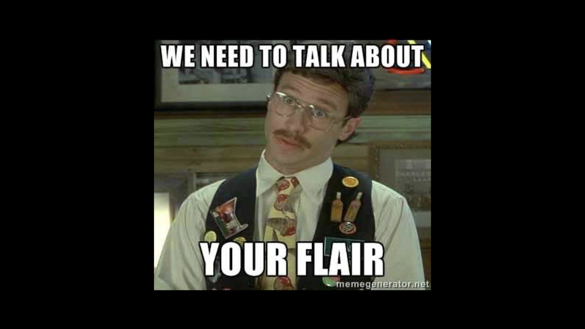 A meme style image of a character from the film Office Space saying 'We need to talk about your flair'. He's a middle aged male with a mostache & glasses wearing a green waistcoat with many, many, many badges.